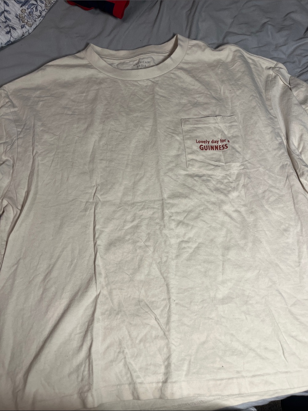 Guinness Off-White Pocket Tee with Red Logo